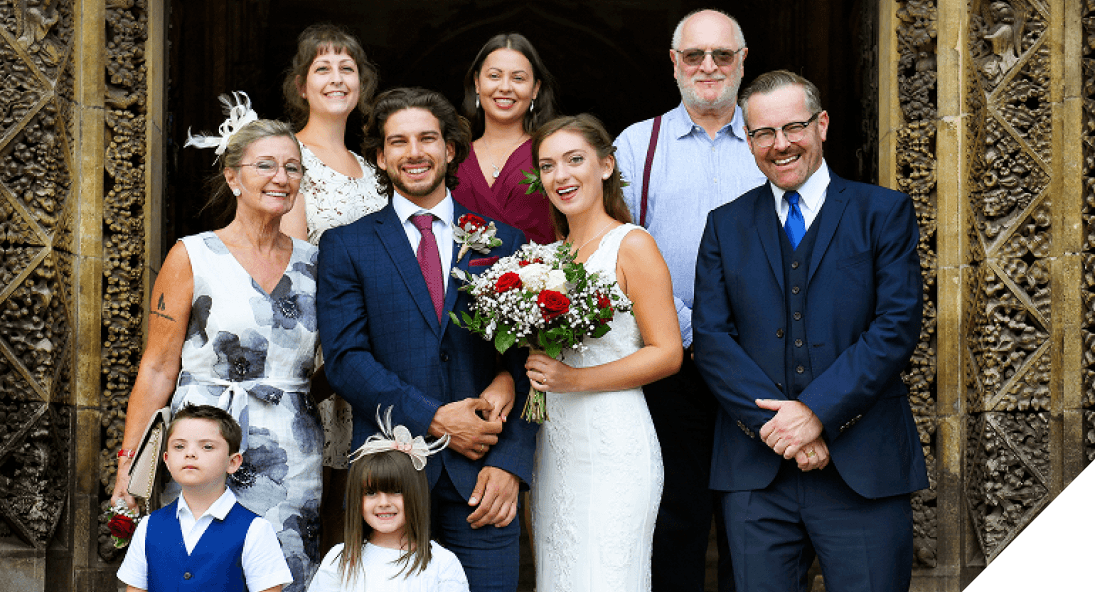 people pose for a photo at a wedding | Sydney Coach Charters